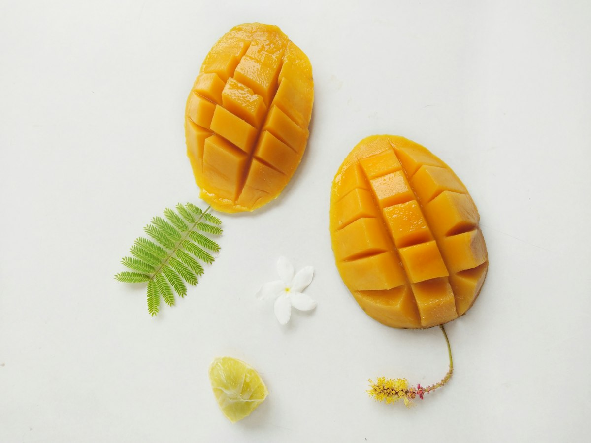 Cut ripe mango showing fresh flesh